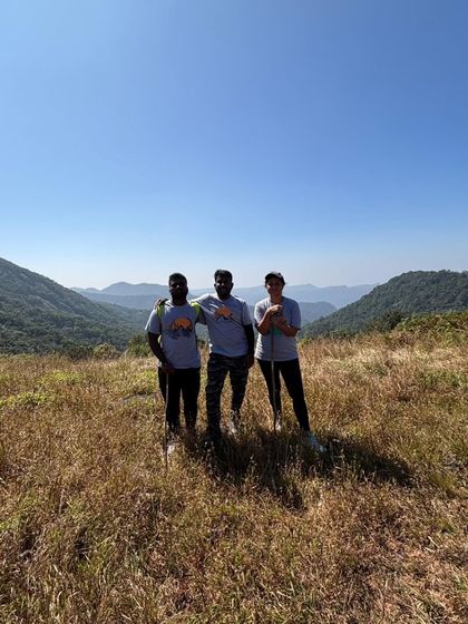 A group of three friends on the grasslands of Narasimha Parvatha.