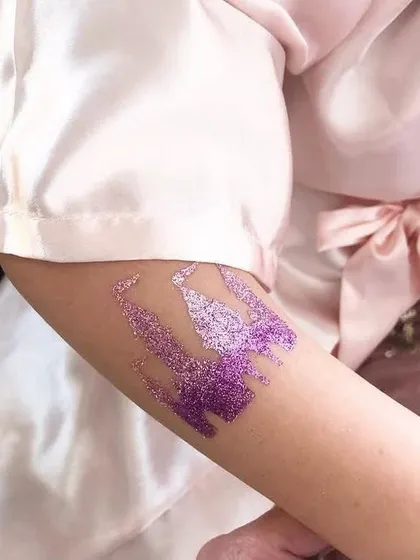A sparkling purple castle tattoo, fit for a prince or princess. This is a great addition to any fairytale-themed party.