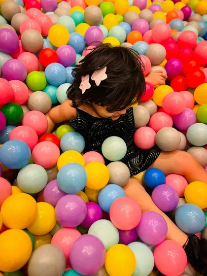 Taking a moment to enjoy the feeling of being surrounded by soft, playful balls.