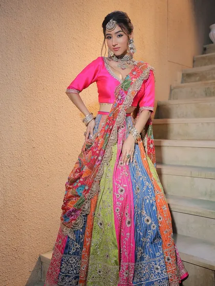 The full view of this incredibly fun and colourful Mehendi lehenga. The makeup is kept bright and glowing to match the playful energy of the outfit.