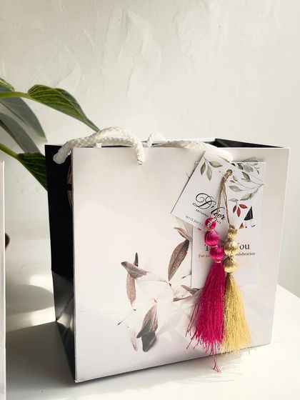 Our elegant gift bags are the perfect way to present party favors. This one was designed for an engagement celebration.