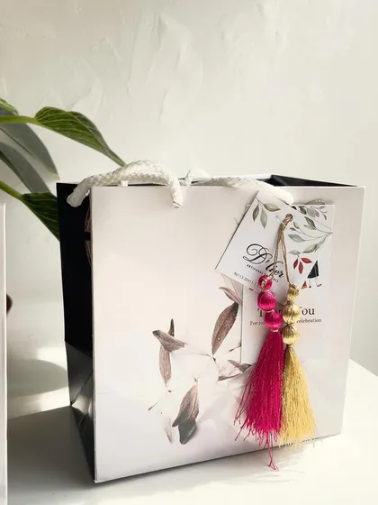 Our elegant gift bags are the perfect way to present party favors. This one was designed for an engagement celebration.