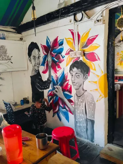 The finished mural at First Choice restaurant in Fort Kochi, painted with the help of the owner's children. This piece shows how I collaborate on-site to create art that is deeply connected to the people and the place, turning a restaurant wall into a local landmark.