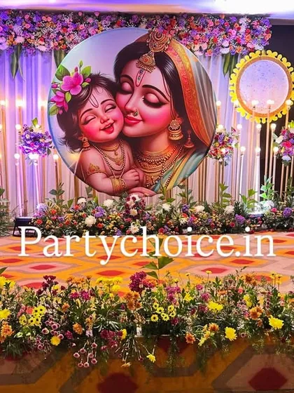 The stage setup for a naming ceremony before the cradle is placed. The design features a beautiful floral stage border, elegant candle-like lighting, and a central illustrated backdrop.