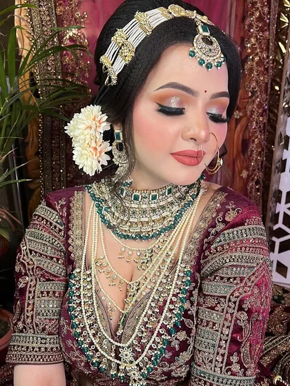 Another angle of this gorgeous bridal look, focusing on the intricate hairstyle and jewelry placement, which are key parts of the overall bridal styling we teach.