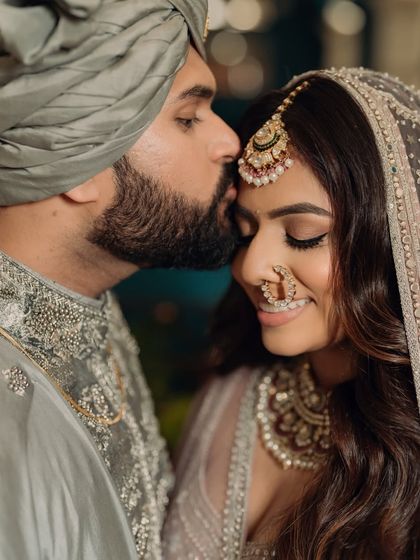 An intimate and romantic close-up of the bride and groom. The bride's soft makeup looks flawless even up close.