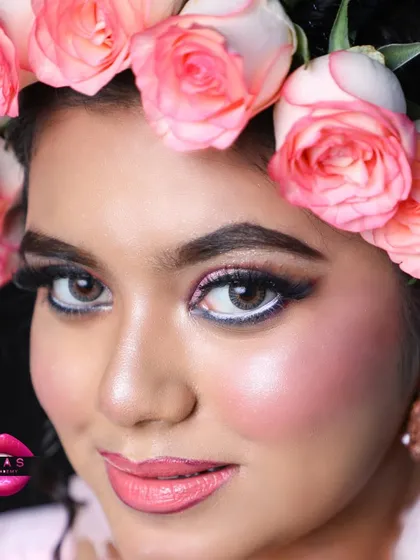 This look is all about fresh, radiant beauty. The glowing skin, bright eyes, and the crown of fresh roses make for a truly unforgettable bridal style.