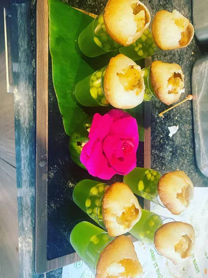 A modern twist on a classic favorite: Gol Gappe Shots. Each puri is served atop a shot glass filled with tangy, spiced water, making it a fun and mess-free way for guests to enjoy this iconic street food.