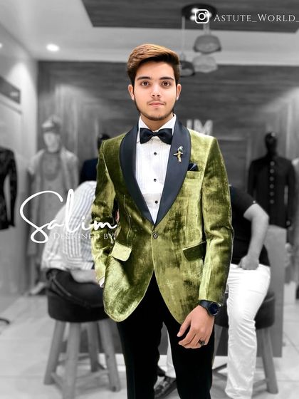 A client in a striking olive green velvet tuxedo jacket. The unique color and luxurious texture make this a memorable piece for any special occasion.