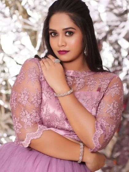 A model wearing a modern lavender gown, accessorized with our diamond-look bracelets and ring. I also offer individual pieces for rent.