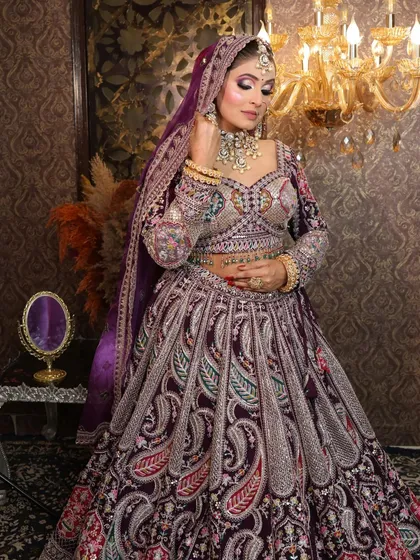 A full view of the purple paisley lehenga, showcasing its grandeur and the way the skirt fans out.