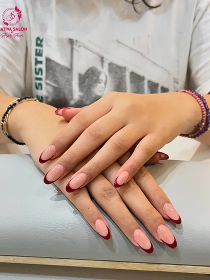 Another angle of our popular red-tipped French manicure. The clean lines and rich color make this a standout choice for anyone looking to update a classic style.