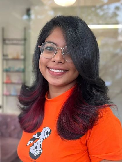 Another angle of the client, her smile and hair are equally bright.