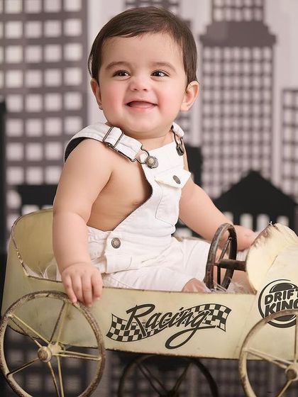 A vintage race car driver in the city. This creative combination of a toy car and a city skyline backdrop makes for a dynamic and fun photograph.
