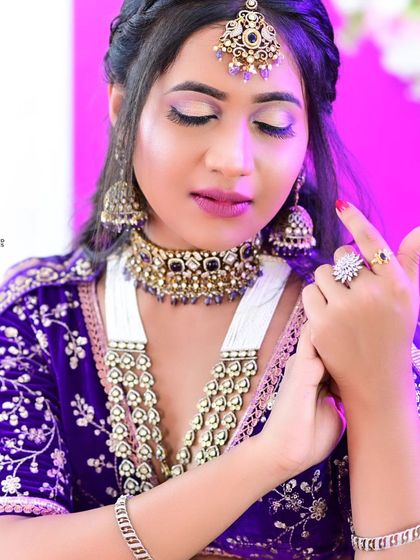 Photos from a makeup class portfolio, where the model is wearing our purple Victorian bridal set with a matching lehenga.