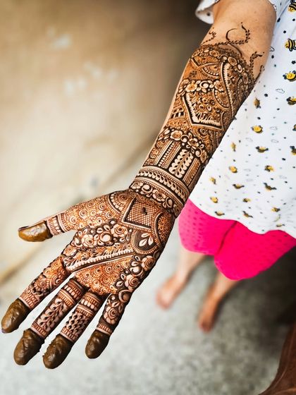 The palm side of the large paisley design, showing a different set of intricate patterns.