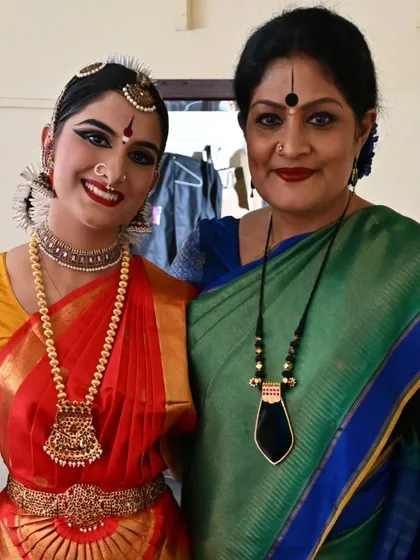 A cherished backstage moment with my student Kavya Navani. As a guru, I am her Akka, her elder sister, supporting her through the nerves and excitement.
