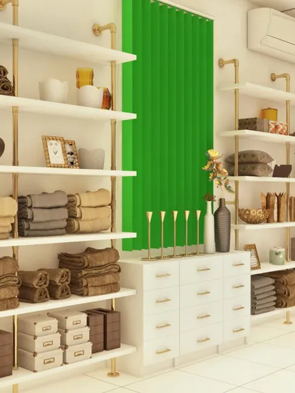 This section shows the display for home goods like towels and linens. The open shelving is made with industrial-style piping for a modern look, providing ample, organized space for folded items.