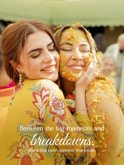 Between the big moments and breakdowns, she's the calm behind the bride. A heartfelt hug between friends, capturing the essence of true support.