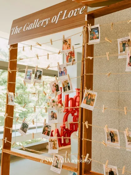 An interactive "Gallery of Love" where guests can find and take home polaroid photos, creating a personal and engaging experience.