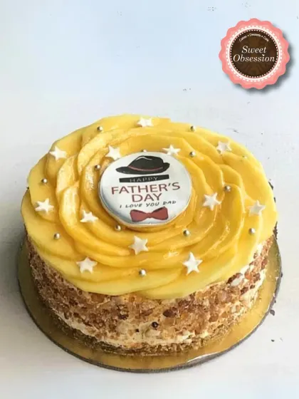 A special Father's Day cake topped with fresh mango slices and a custom "Happy Father's Day" chocolate disc. It's a sweet and refreshing treat for Dad.