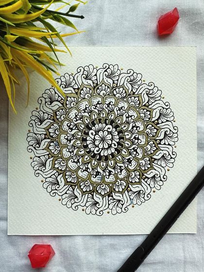 A closer look at the classic black and gold mandala. The gold pen adds a subtle highlight that elevates the entire design.