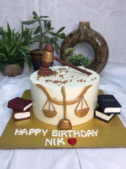 A front view of the custom cake for a lawyer's birthday.
