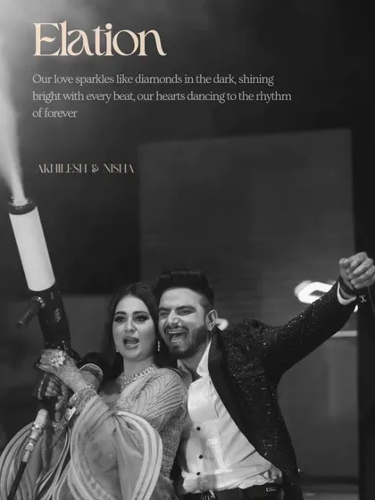 A black and white shot of the couple having a blast with a CO2 gun, capturing the high-energy and fun side of their celebration.