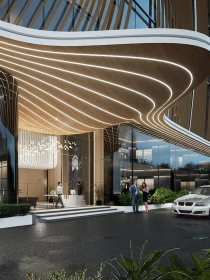 A detail of the entrance canopy, showing how the illuminated lines guide visitors into the building while highlighting the structure's complex, organic form.