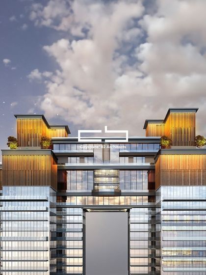 This residential tower features an innovative design that plays with volumes to create a visually striking silhouette. The glazed facade reflects modernity, while a rooftop with greenery adds a touch of nature, blending urban living with sustainable aesthetics.