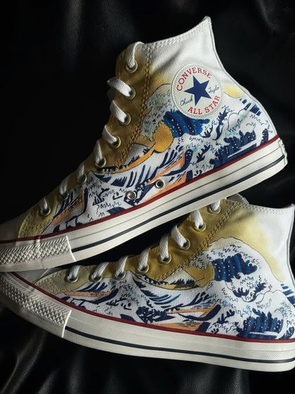 A top-down view of "The Great Wave" custom Converse.