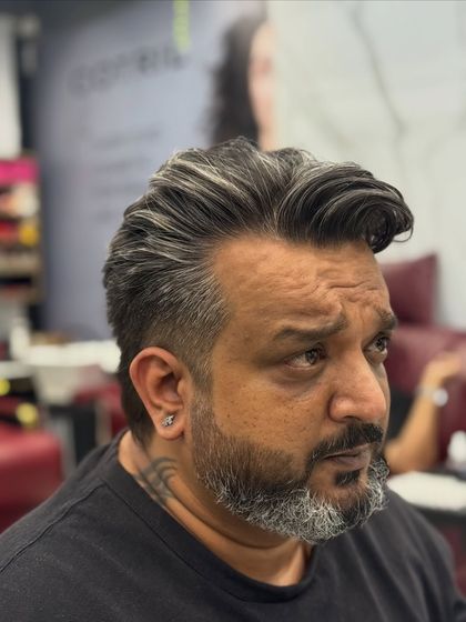 Another angle of the sophisticated salt and pepper look, showing the volume and styling.