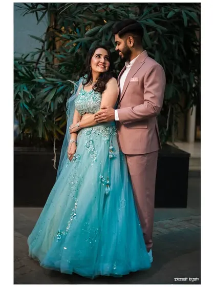 A full-length portrait that feels both classic and modern. The bride's light blue lehenga is a beautiful and unique choice.