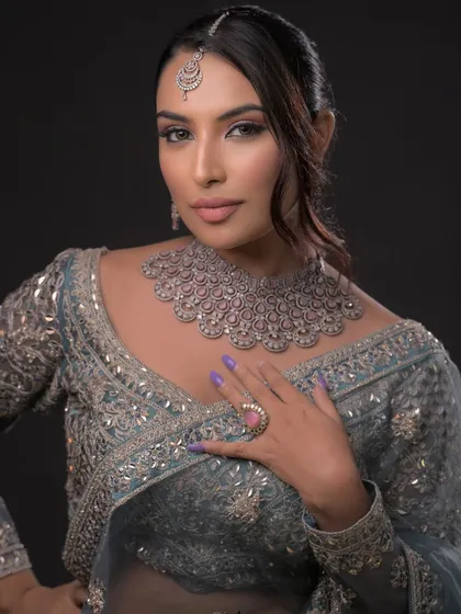 This look, styled like a jewelry shoot, teaches students how to do makeup that highlights accessories. The focus is on clean lines and a glowing complexion.