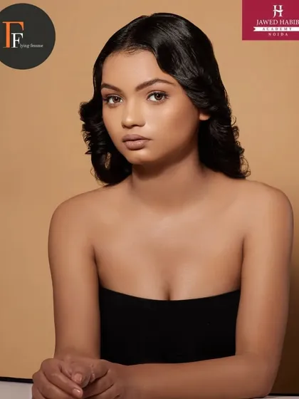 Another angle of the model, showcasing the soft and timeless beauty look.