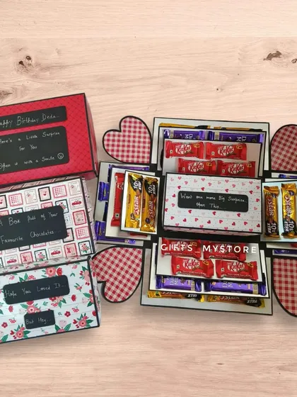 A full view of the custom chocolate explosion box designed to gift a phone. It has multiple layers of chocolates and messages leading up to the main surprise.