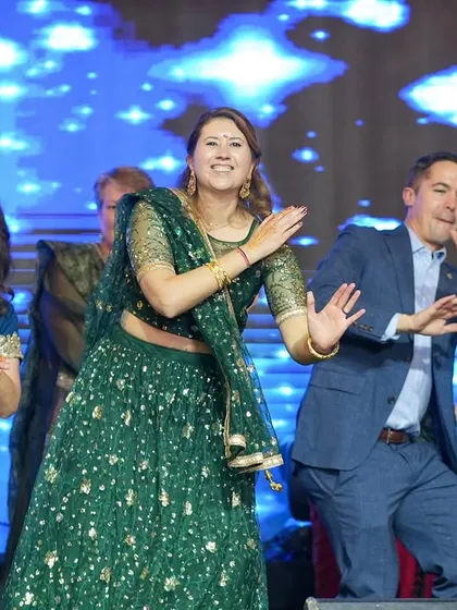 Another happy moment from a family group dance. We coordinate formations and steps so that large groups look synchronized and professional, creating a huge impact at the Sangeet.