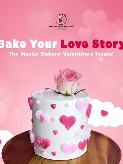 Bake your love story with our special Valentine's treats. This cake, adorned with pink hearts and a single fresh rose, is a perfect example of how we craft sweet moments for you and your loved one.