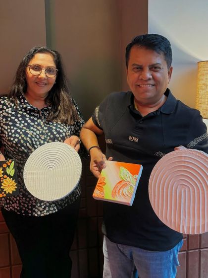 A lovely couple showing off their finished texture art pieces. It's a wonderful activity for couples to do together, resulting in beautiful handmade decor for their home.