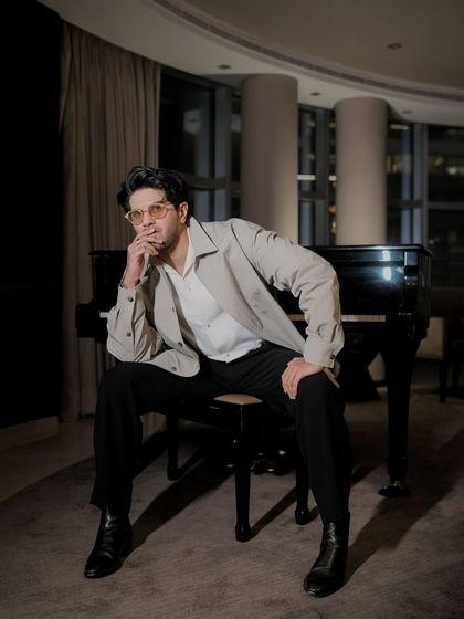 A thoughtful pose from Dulquer. This look is all about effortless elegance and modern sophistication.