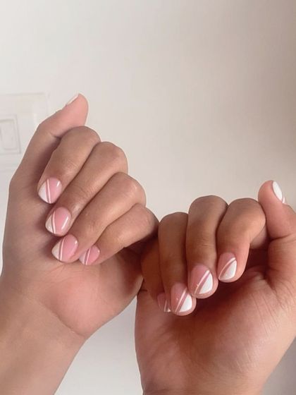 Short nails can be fun too! A simple geometric design with pink and white on short, natural nails.