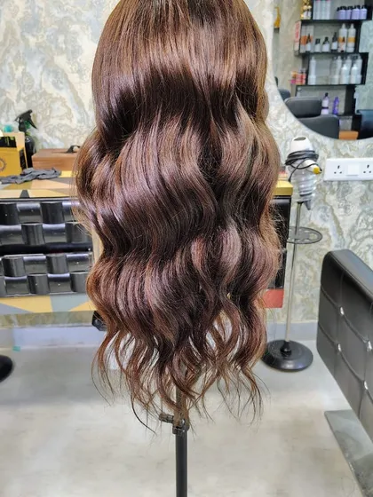 We believe hairpieces should be as fun and stylish as you are. This custom-colored and styled wavy wig shows the beautiful dimension and life our 100% human hair pieces have. You can style them just like your own.
