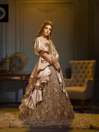 A beautiful golden gown with 3D floral work, perfect for a bride who wants a unique reception look.