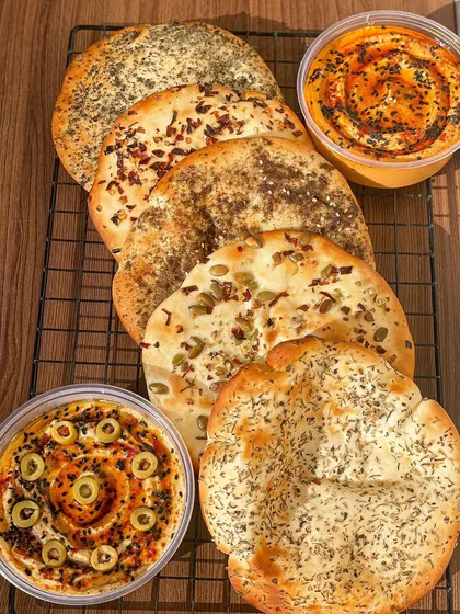 A beautiful spread of my assorted pita breads and hummus dips, perfect for a healthy and flavorful party platter.