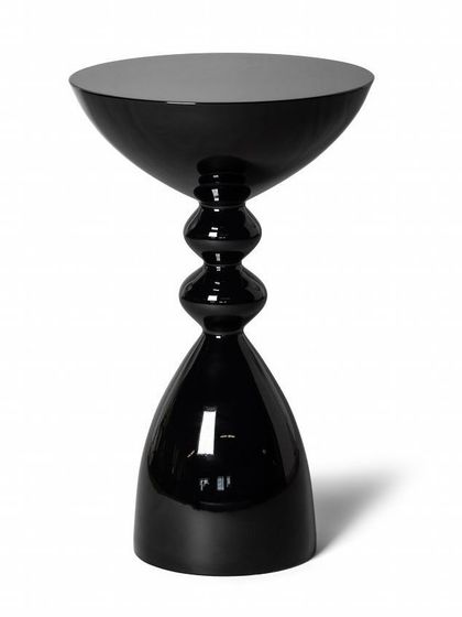 An inspirational design for a side table with a glossy black powder-coated finish. Its stacked, geometric form makes it a sculptural accent piece for any contemporary space.