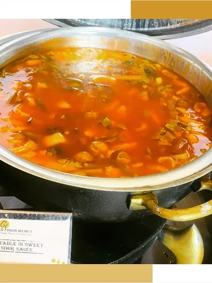 A chafing dish filled with Vegetables in Sweet & Sour Sauce, a classic offering from our Chinese cuisine menu.