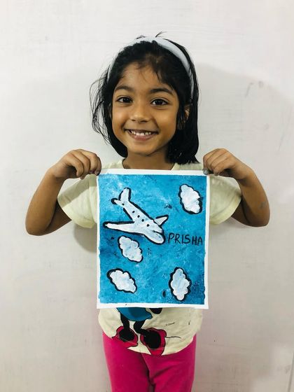 Prisha, from our 5-7 year old group, with her fantastic airplane painting. We teach basic composition and painting techniques in a way that's easy for young children to understand.