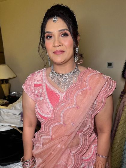 A soft and pretty look for this lovely lady. I used pink tones to give her a fresh and youthful appearance for the wedding festivities.