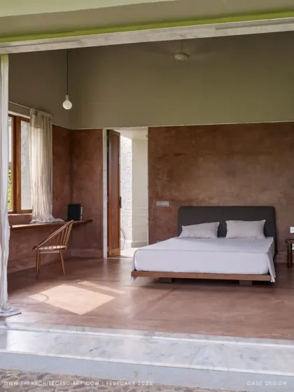 The bedroom at Villa Uma opens directly onto the garden, blurring the boundary between inside and out. The minimalist design, with its built-in furniture and natural materials, creates a calm and restful retreat.