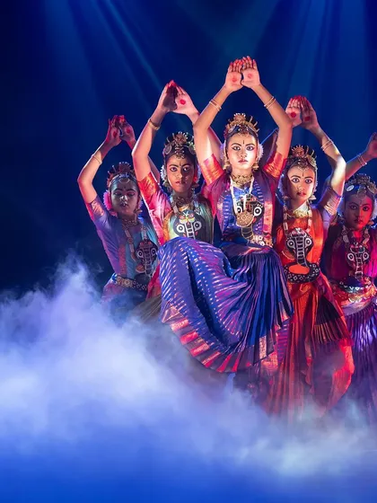 A powerful moment from our theatrical production, 'KRISHNA - Love, Compassion, and Protection'. Here, my dancers embody the collective energy of the universe, captured through dramatic lighting and ethereal stage effects, perfect for creating a memorable experience at large-scale events.
